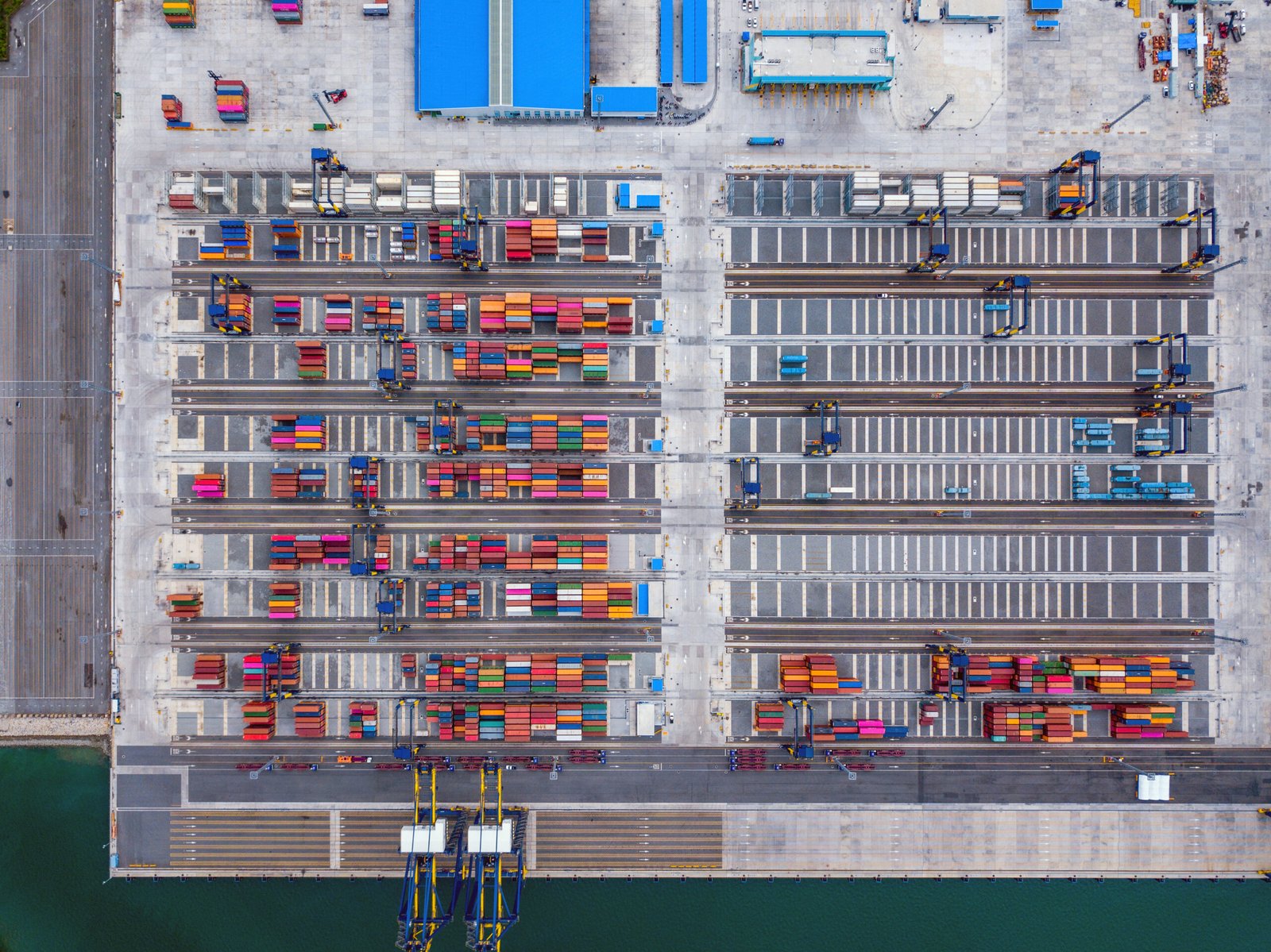 Aerial top view of container cargo ship in the export and import business and logistics international goods in urban city. Shipping to the harbor by crane in Laem Chabang, Chon Buri, Thailand